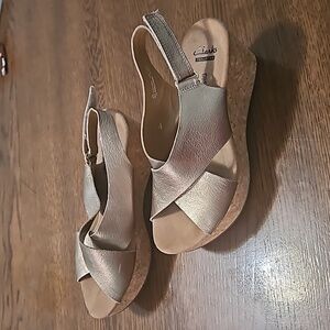 Clarks collection wedges with shimmery gold straps size 6.5